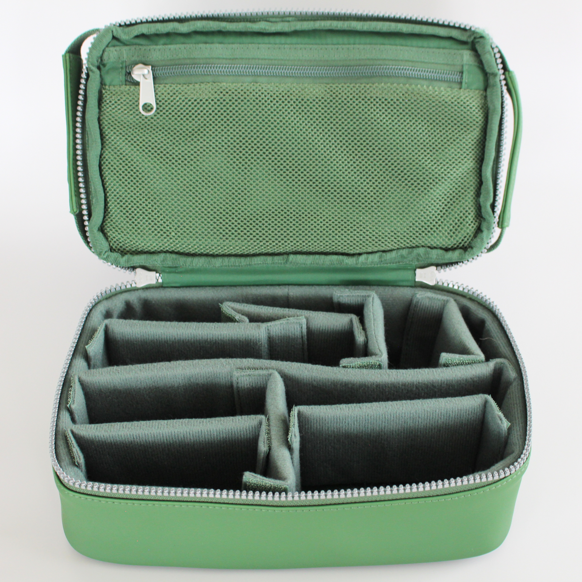 Green diabetes travel bag with multiple compartments on a light gray background