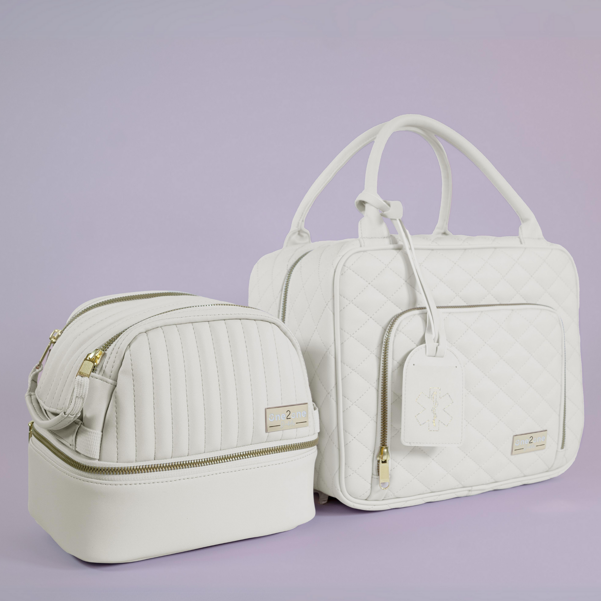 A small white diabetes travel bag next to a large white diabetes travel bag on a purple background.